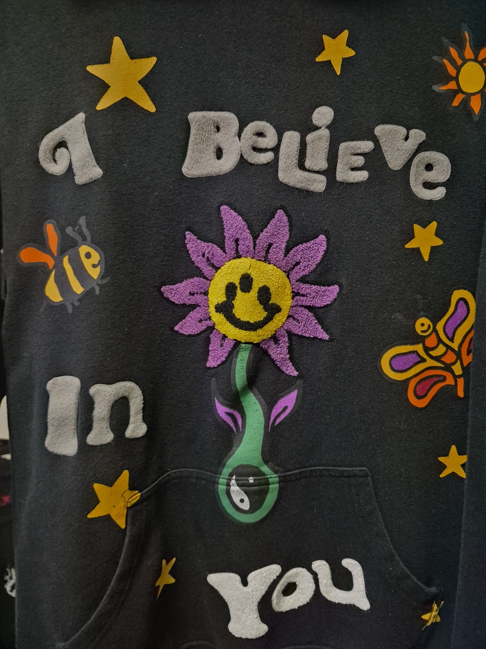 Unisex !PacSun Black 'I Believe In You' Graphic Hoodie with Purple Smiley Flower